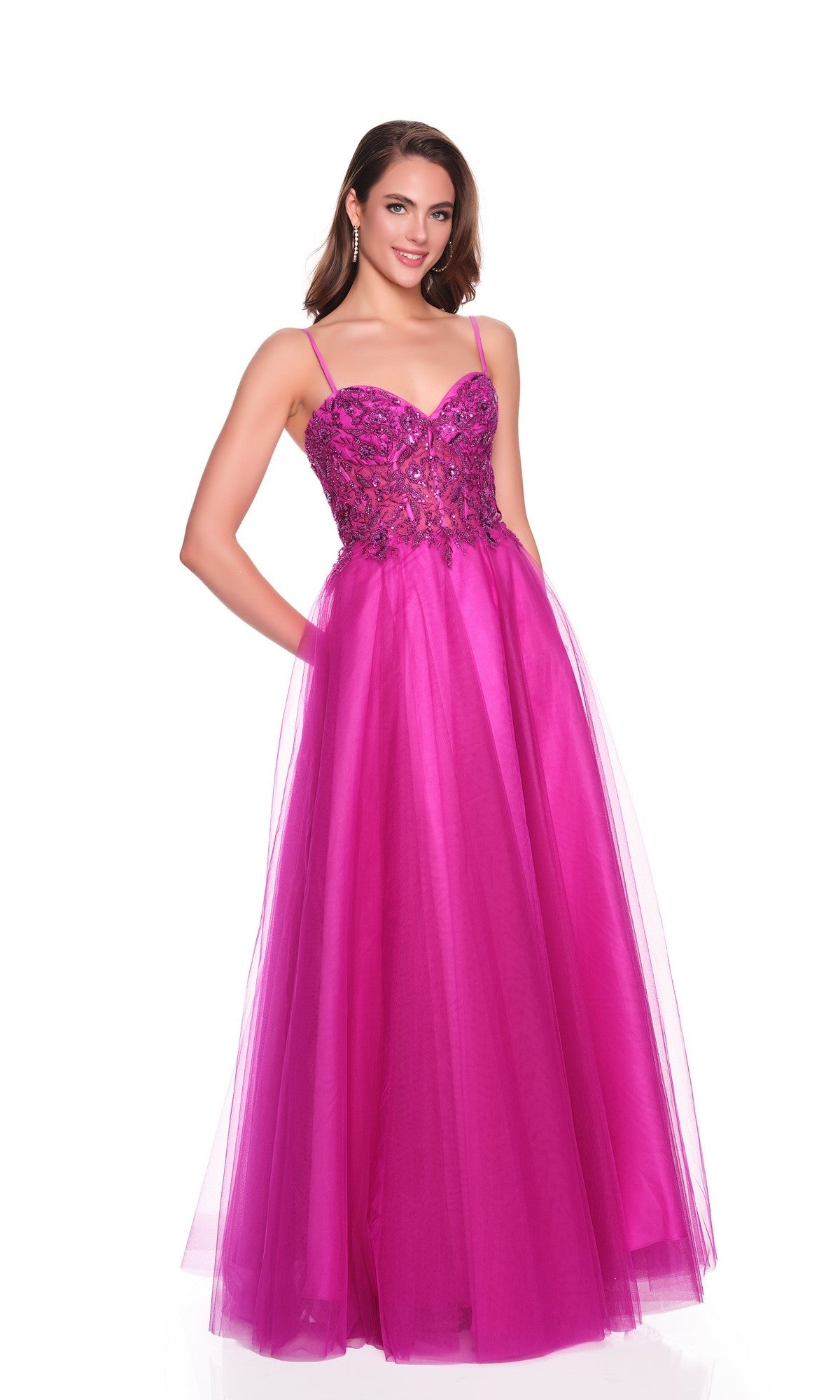 A woman models the Dave and Johnny 12582 long magenta prom dress, featuring an embroidered corset bodice and flowing tulle A-line skirt, posed against a white background.
